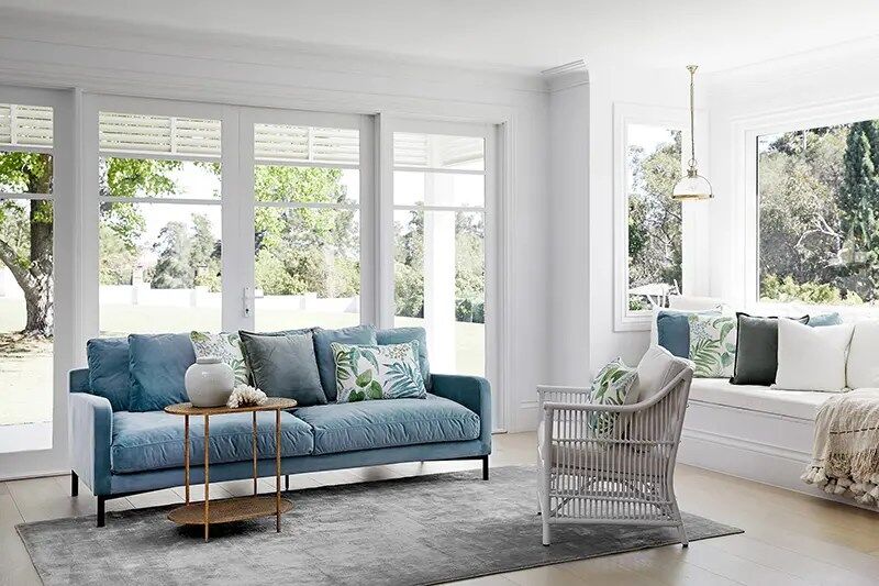 blue sofa and white armchair